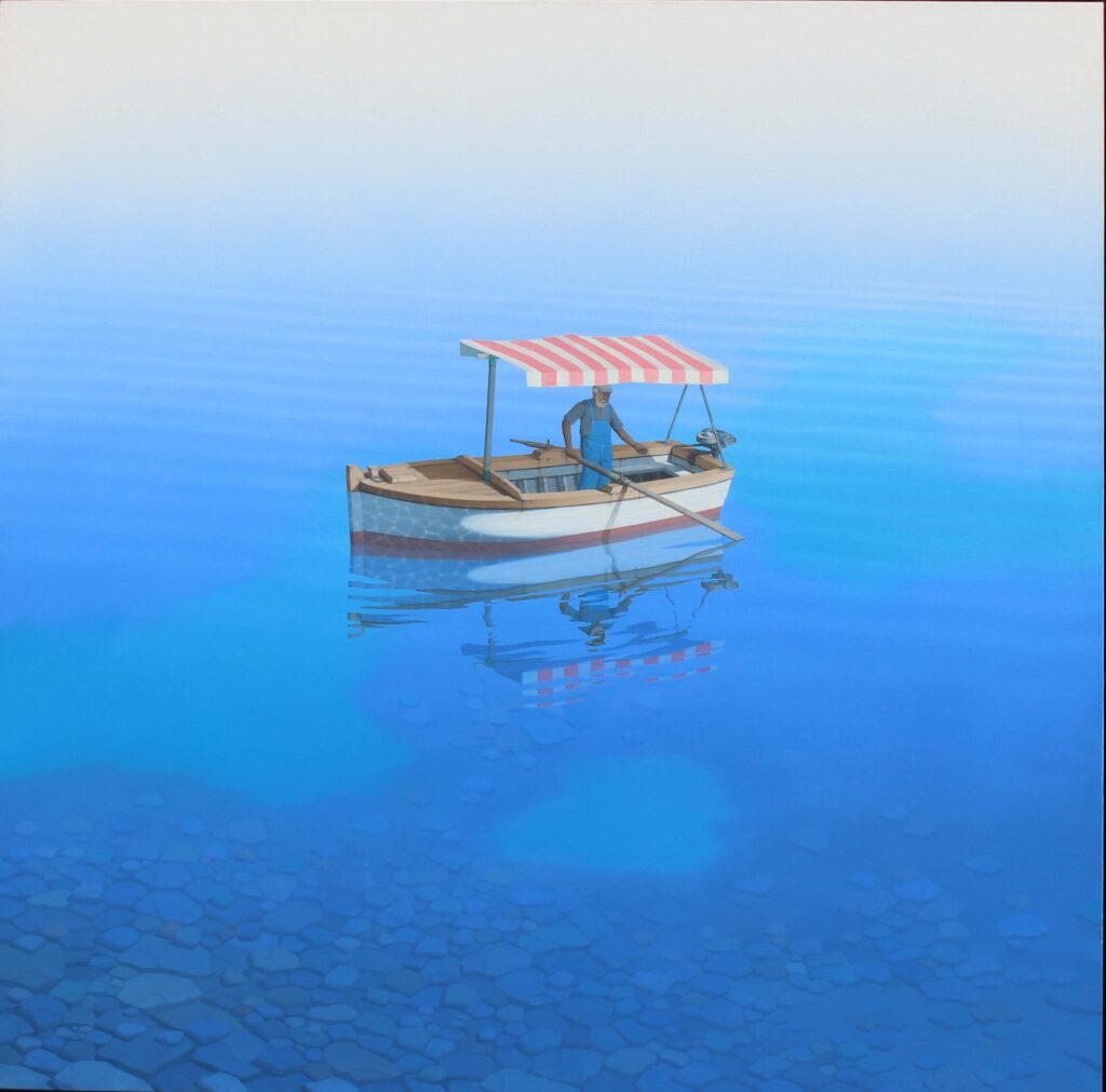 Solitary fisherman in a small boat with red and white striped canopy on calm, clear blue water revealing stones beneath under a pale sky.
